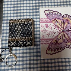 Two tiny little plain paper books